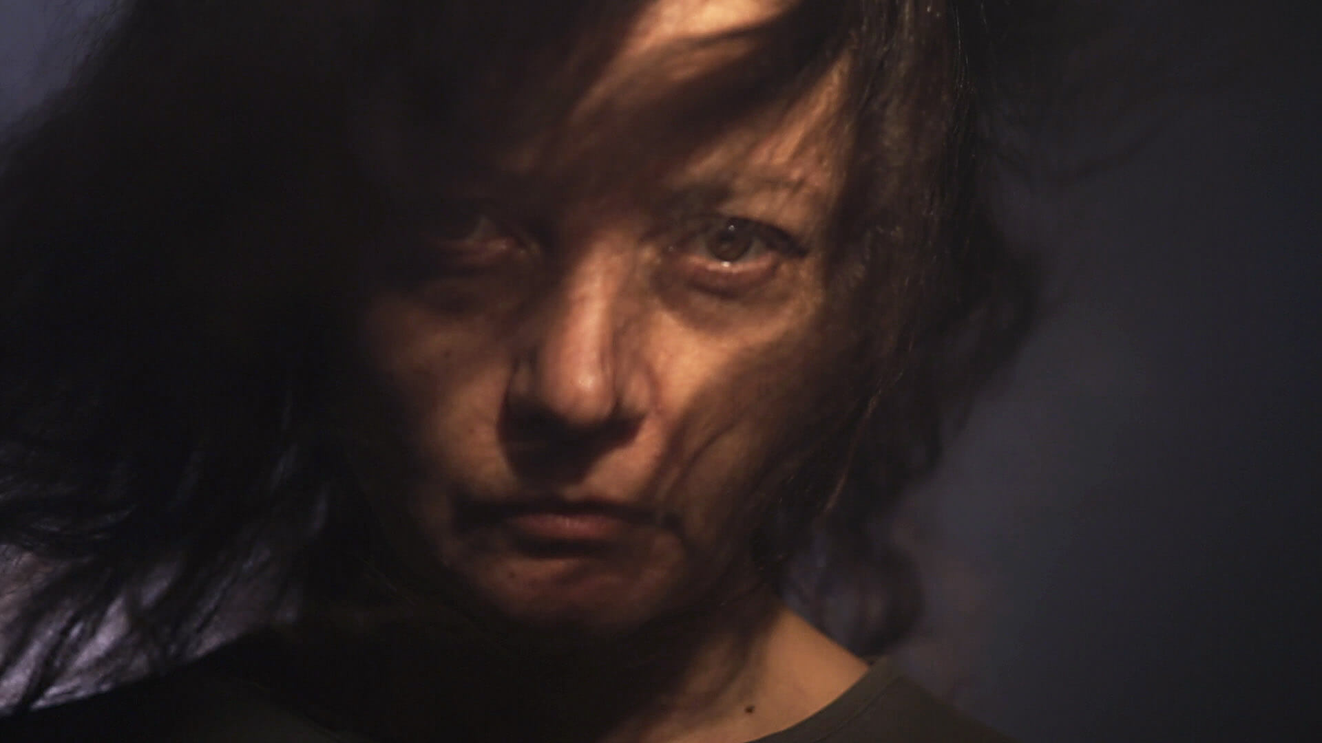 A frame from the movie Mama why are they killing us